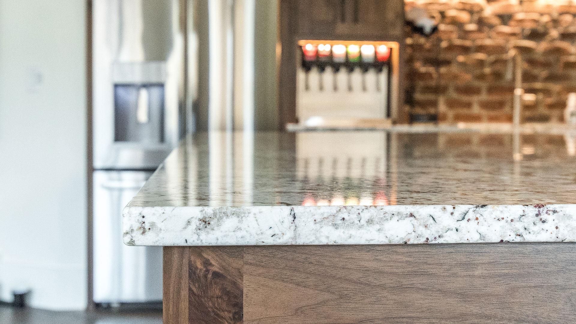 WHITE SPRINGS.3 granite countertop in kitchen with soda machine in the background